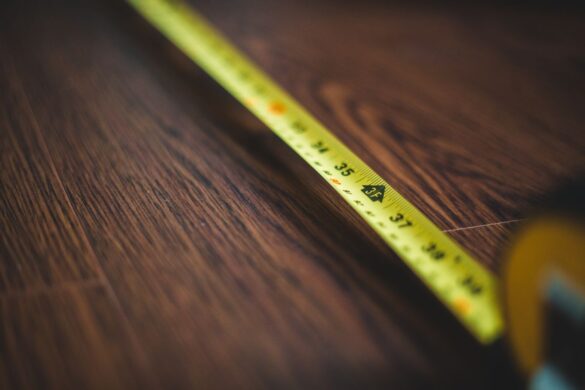Yellow tape measure extended, symbolizing band vs cup measurement