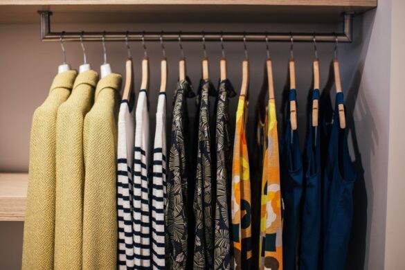 Colorful garments on hangers in a boutique