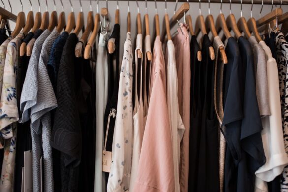 Stylish women's clothing on hangers in a boutique