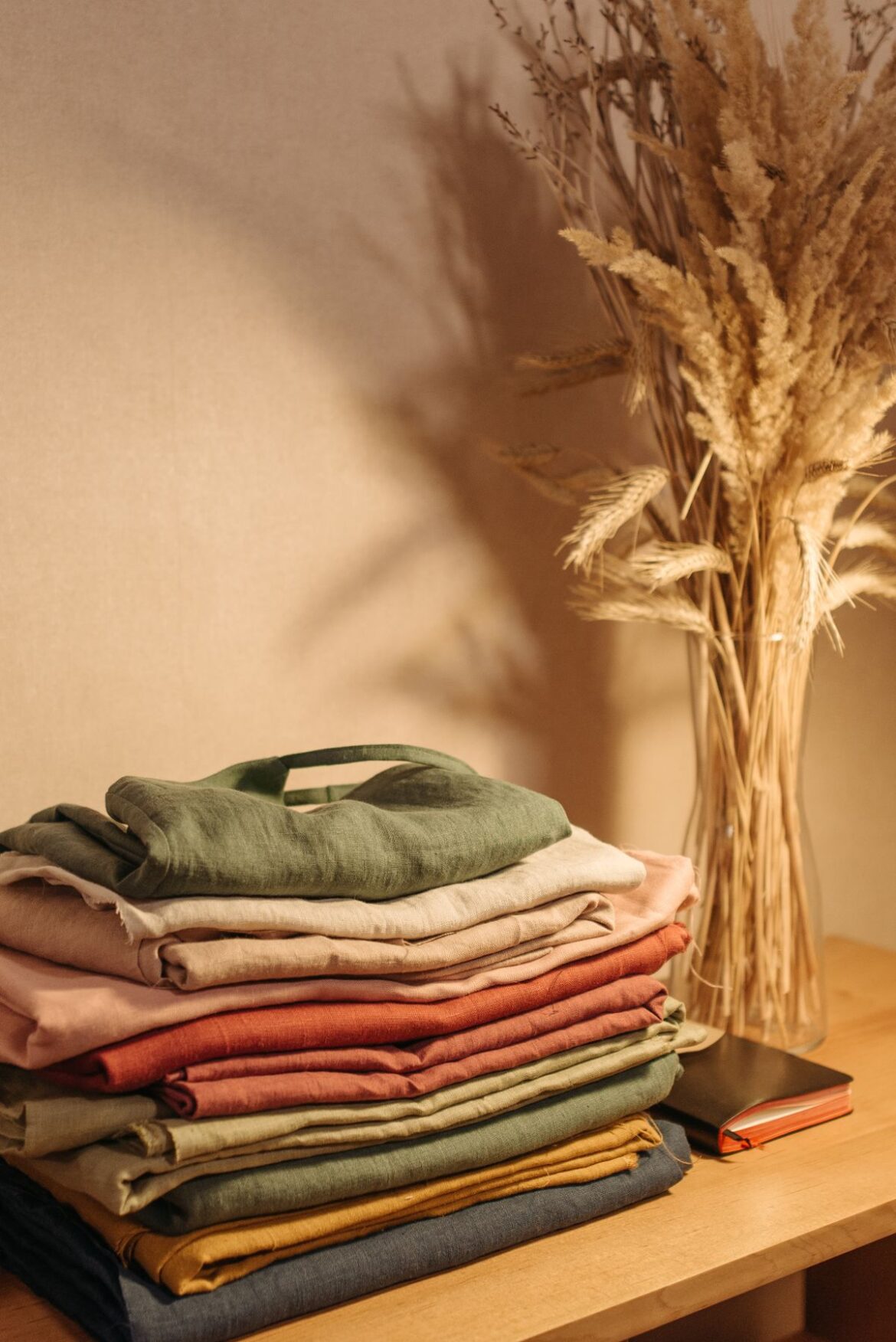 Stack of neatly folded clothes, streamlined wardrobe