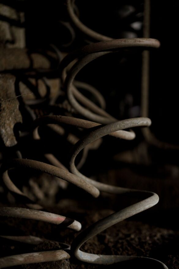 Close-up metal spring coil, representing underwire structure