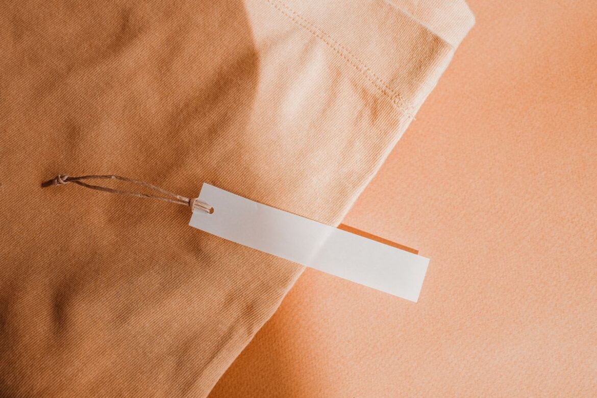 Close-up of a blank fabric tag, garment care and repair