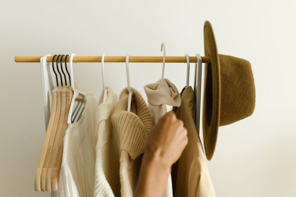Clothing rack in a closet, organized wardrobe collection